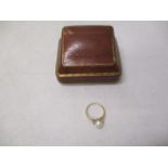 A 9ct gold ring set with a pearl in a brown leather clad box, 2g