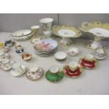 A selection of early to late 20th century bone china to include ornate coffee cans with saucers, a