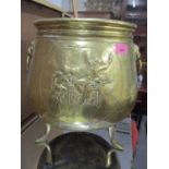 A brass jardiniere with lion mask handles 14"h x 12 1/2"w