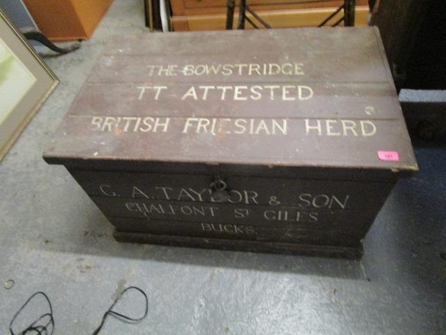 A late 19th/early 20th century painted wooden trunk with lettering to the front and lid reading