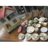 A vintage Triang doll house, together with mid 20th century dolls furniture and a larger dolls