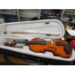 A child's violin, a bow and a case
