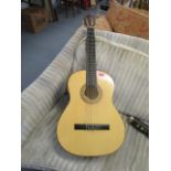 A Hohner full size acoustic guitar