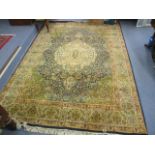 A machine woven rug having a floral design, multiguard borders and tasselled ends 110" x 77"