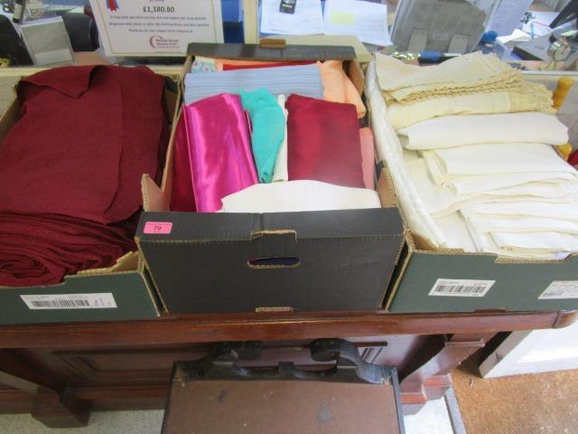 A quantity of damask linen and a selection of upholstery/seamstress material, cushion covers etc