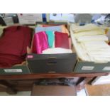 A quantity of damask linen and a selection of upholstery/seamstress material, cushion covers etc