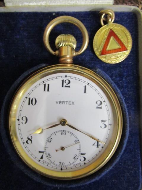 A Vertex gold plated pocket watch with 15 jewel movement, white enamel Arabic dial, off set