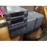 A Panasonic double cassette CD receiver with speakers, model 5A-CH55 and two Pioneer surround