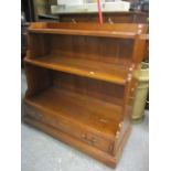 A reproduction walnut waterfall bookcase with drawer below 34 1/2"h x 36"w