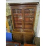 A Victorian mahogany glazed bookcase cabinet