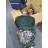 A picnic bag containing outdoor plastic Pimms jugs and glasses, brand new