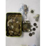 A selection of British and foreign coinage to include pre and post-1947 shillings