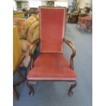 Circa 1920 a mahogany upholstered open armchair