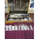 An oak cased A1 graded cutlery and flatware set with rat tail and pistol grip handles and bowls,