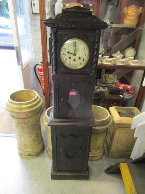 A late Victorian/early 20th century oak cased, longcase clock with key and pendulum