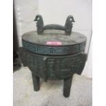 An ice bucket having Mayan inspired designs