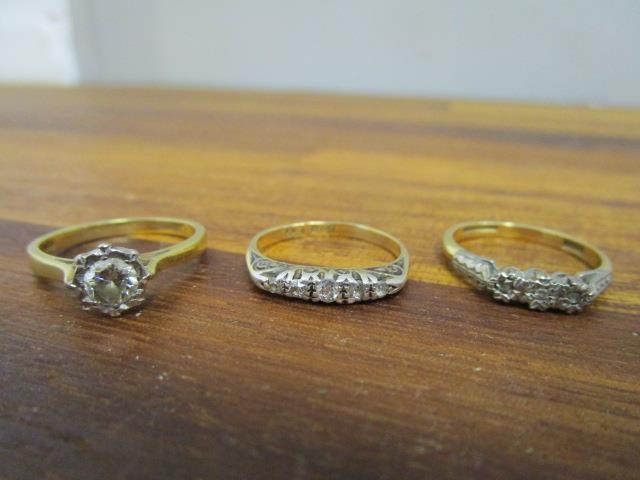 An 18ct yellow gold and illusion set diamond solitaire ring, an 18ct yellow gold and platinum