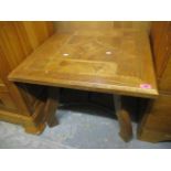 A modern square topped occasional table having inlaid geometric designs and metal supports 20"h x 26