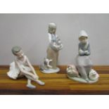 Two Lladro porcelain figurines, one depicting a girl with cats, the other a woman with a duck and