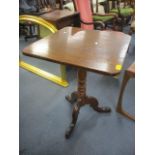 A 19th century mahogany and oak occasional table having a turned column and three cabriole legs 28