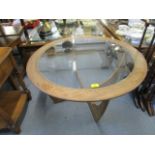 A G-Plan teak and glass topped circular coffee table circa 1970