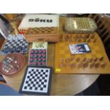 A selection of wooden and stone chess sets and boards