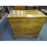 A 19th century pollard oak chest of two short and three long drawers with swan neck brass handles on