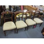 A set of four Victorian mahogany bar back dining chairs