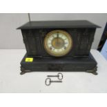 A Victorian black marble cased mantel clock, with ram mask handles, on cast feet