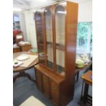 A modern mahogany two door cabinet having single fitted shelf 27 1/2"h x 34"w