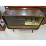 A Regenttone stereo/radiograph with Maranch record deck housed in a mid century teak case