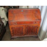 A 19th century mahogany bureau bookcase with a blind fret carved cornice over, twin astrigal