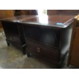 A pair of Stag Minstrel mahogany finished bedside cabinets, with a shelf and a drawer