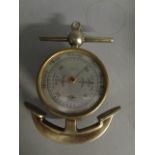 A Shortland Brothers compensated barometer in the form of an anchor in a silver plated casing