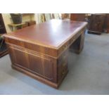 A Sapele finished, twin pedestal partners desk, circa 1900