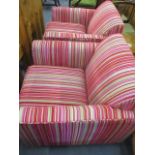 A pair of Cargo multi coloured fabric upholstered armchairs