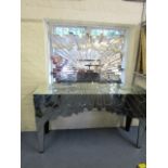 A contemporary Swarovski glass clad console table, 33" x 55" x 16 1/8" and a matching mirror, 47 3/