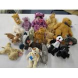 A collection of Beanie Babies to include the 2000 bear in purple and a smaller example in mottled