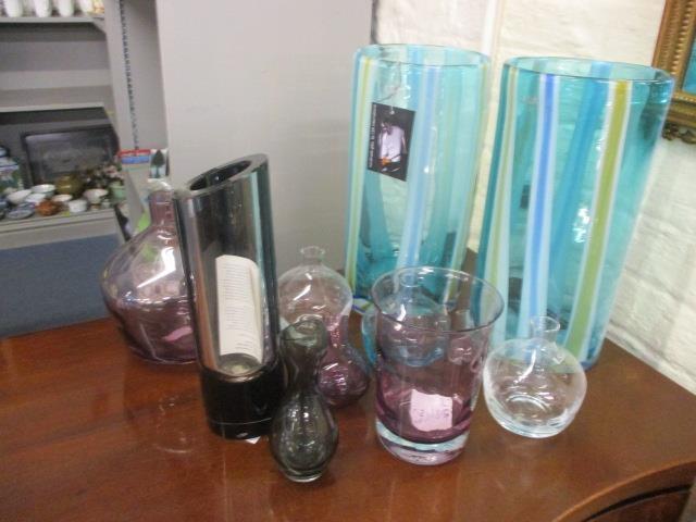 A mixed lot of glassware to include LSA vases and other items