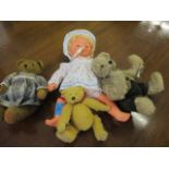 Three collectors teddy bears and a retro Tiny Tears doll