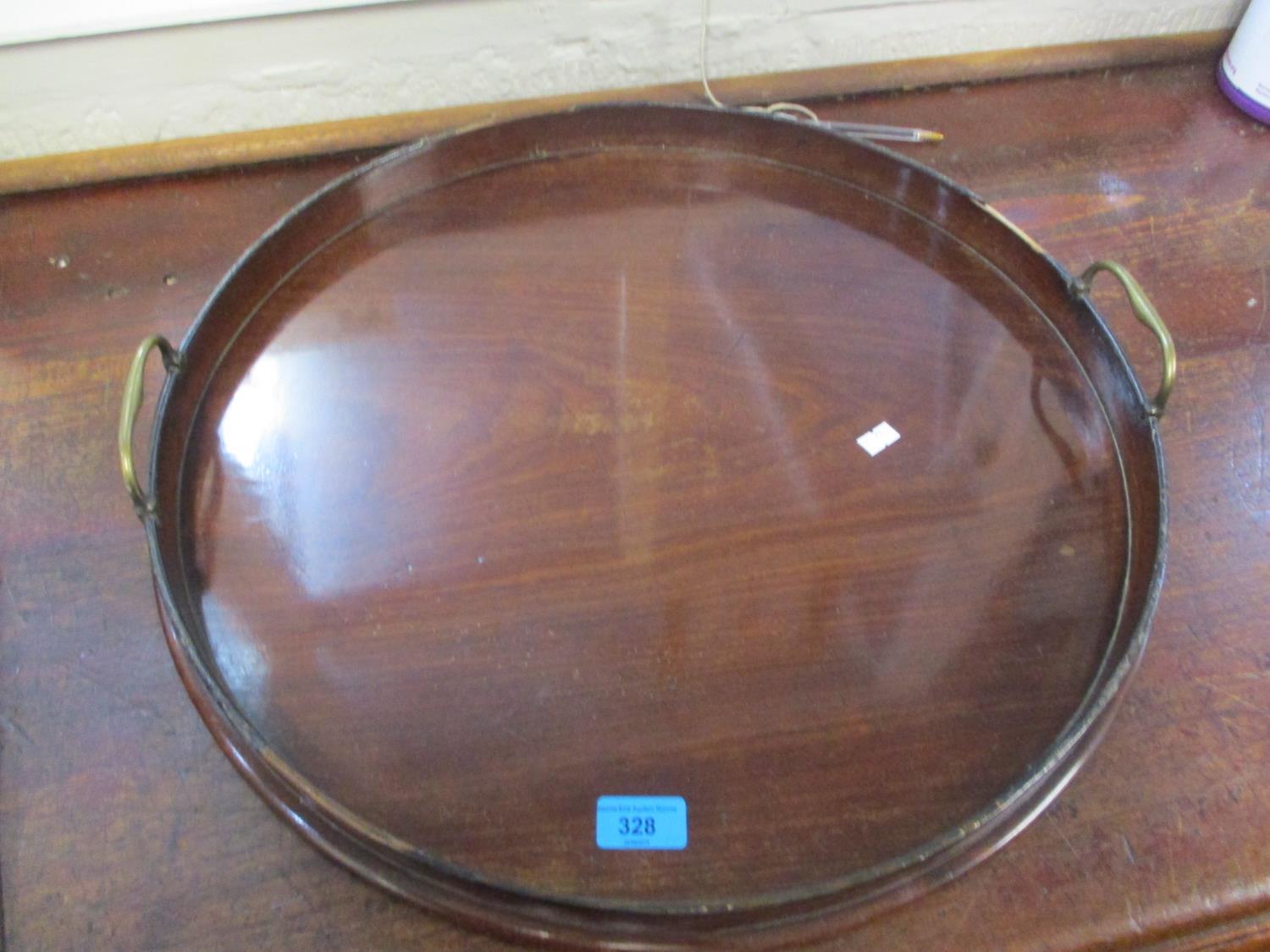 A 19th century mahogany, brass twin handled tray, 21" dia