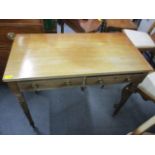 A Victorian mahogany side table on ring turned legs