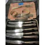 A cased set of early 20th century, silver handled butter knives, a Bravingtons silver napkin ring,