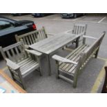 Teak garden furniture comprising a slatted table, 26" h, 58" w, two benches, one in need of repair