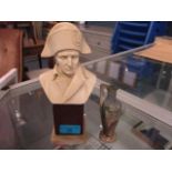 A composition resin bust of Napoleon on a wood and onyx plinth and a French miniature art pottery