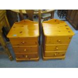 A pair of modern pine three drawer bedside cabinets