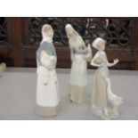 Three Lladro figures in the form of young girls with geese and a lamb