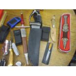 A collection of pocket and other knives and handyman tools