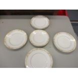 A set of five Royal Copenhagen plates with floral and scroll pattern