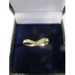 A 9ct yellow gold and diamond set ring